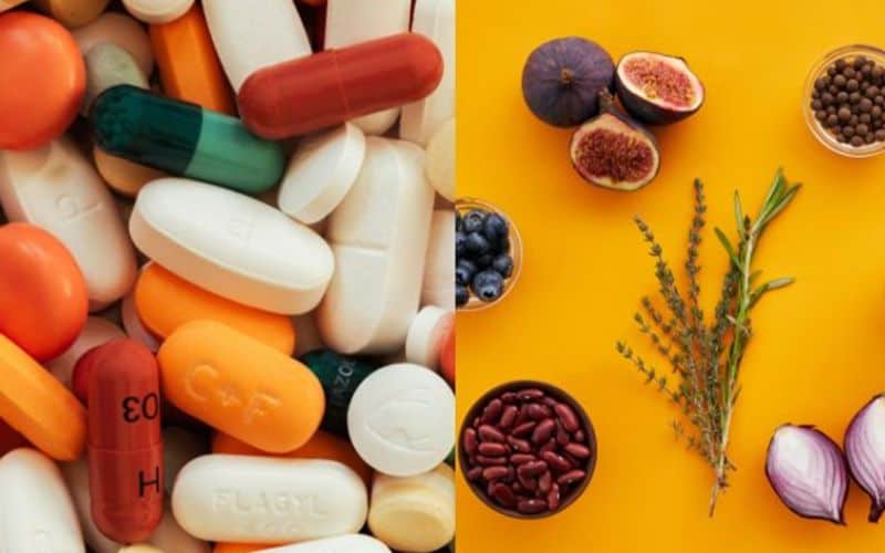 Modern medicine pills next to traditional herbal medicine